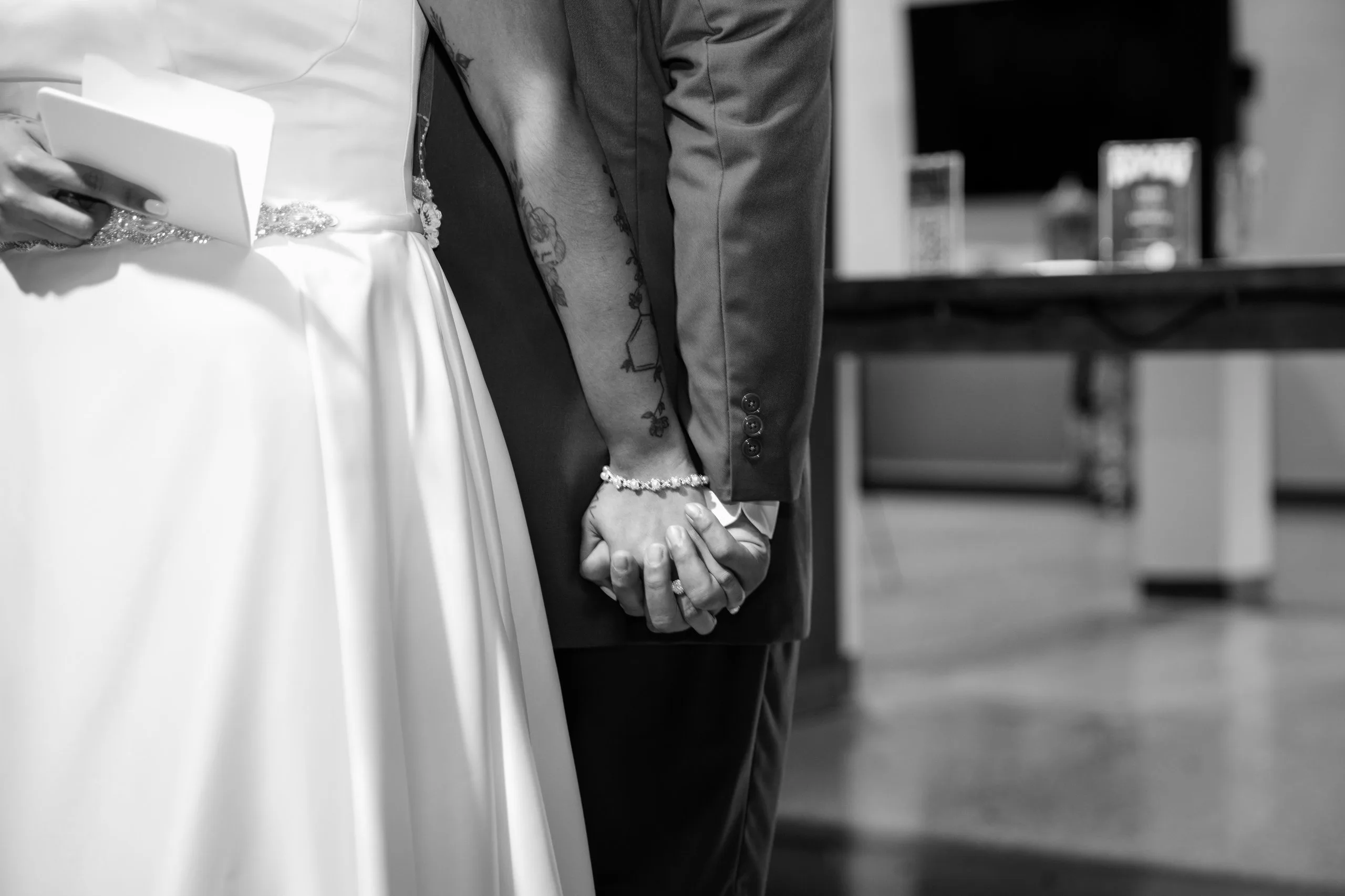Hands and wedding dress detail, black and white