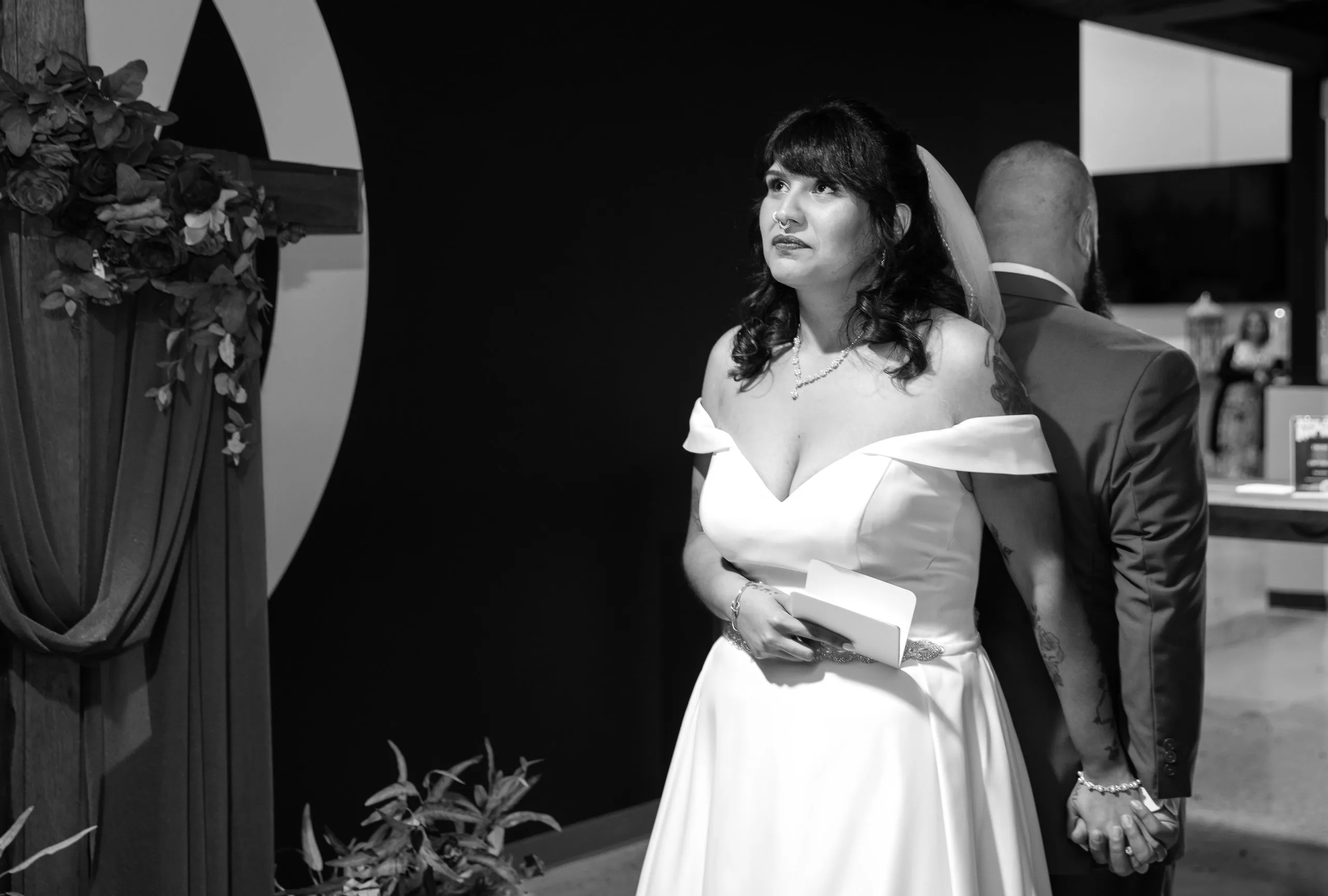 Bride in soft window light, black and white portrait